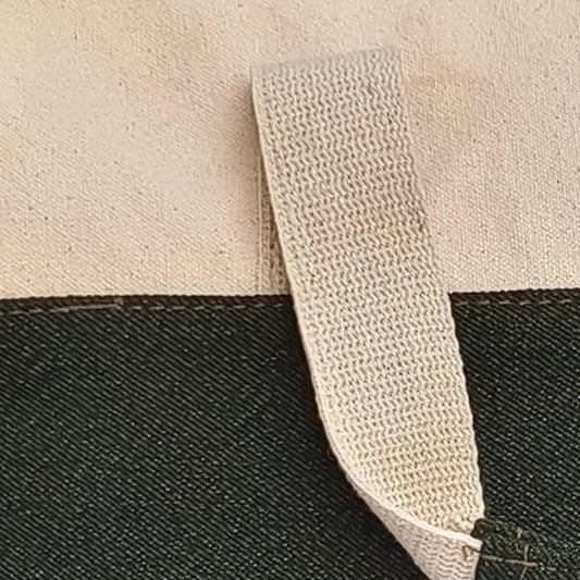 Two-Tone Cream and Dark Green Canvas Laptop Messenger Bag with Adjustable Shoulder Strap.